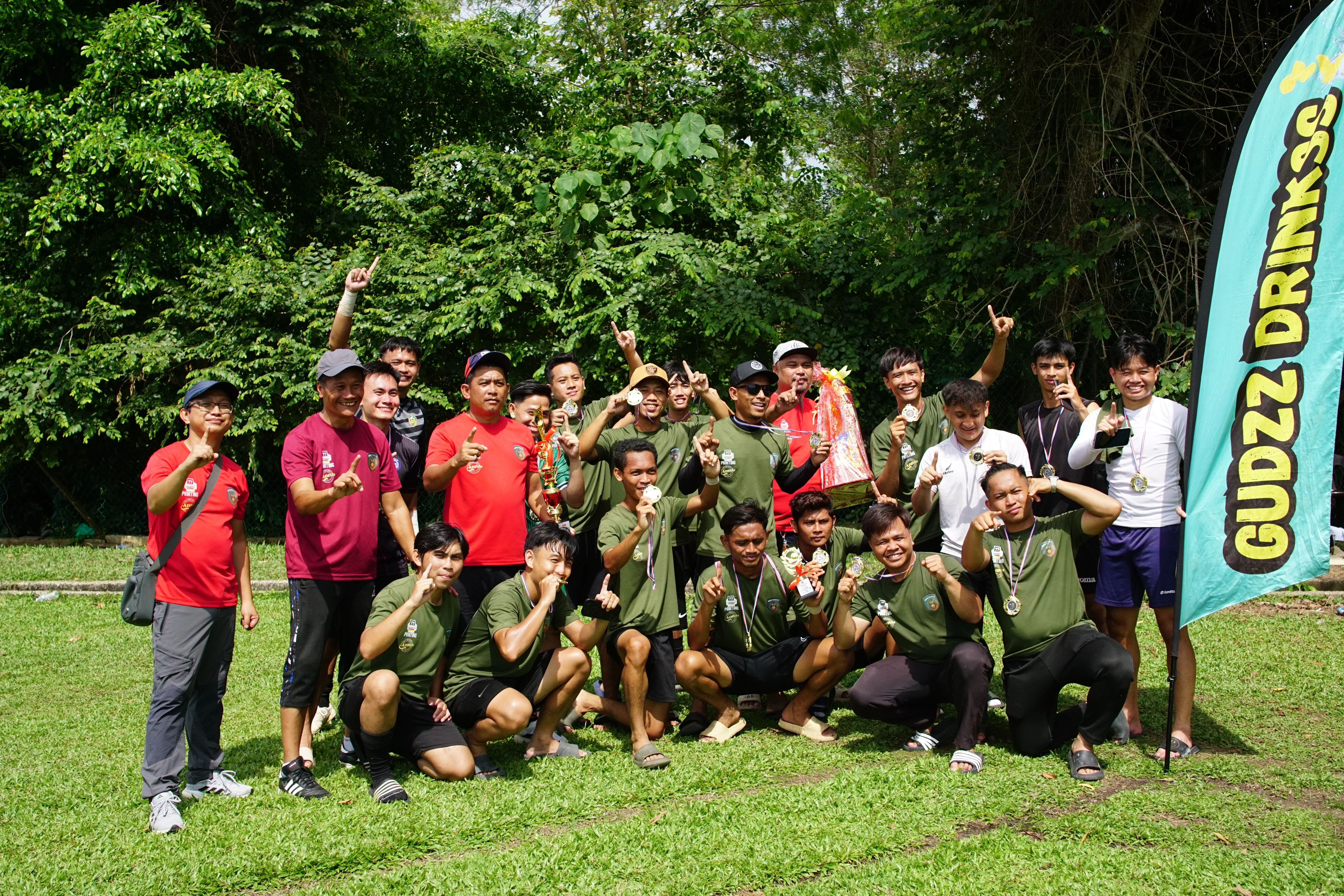Borneo Rovers FC players celebrating with trophy and medals after Liga Yodenz 55